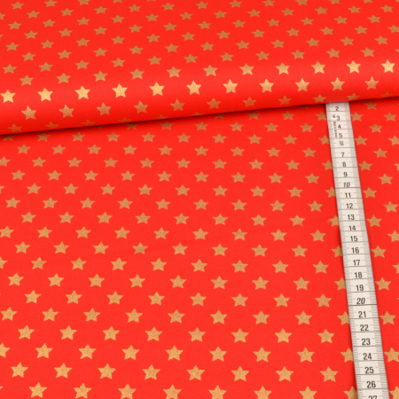 Tissu coton imprimé métallisé - étoiles dorées sur rouge