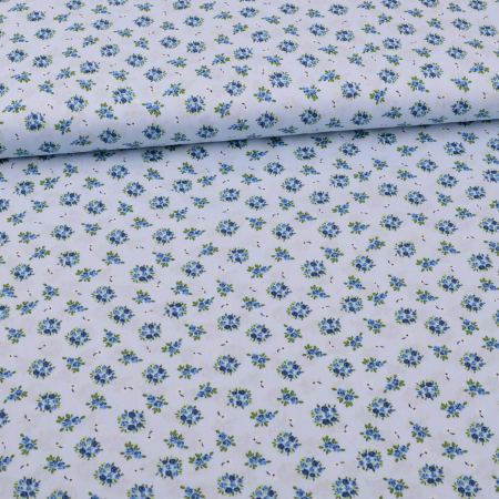 Tissu coton petits bouquets de fleurs sur bleu clair