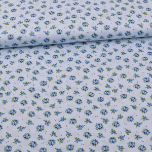 Tissu coton petits bouquets de fleurs sur bleu clair